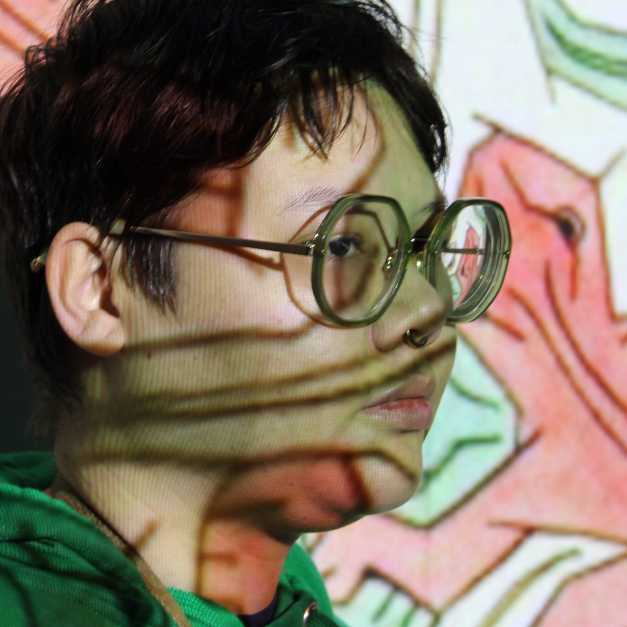 portrait of woman in front of a projected image